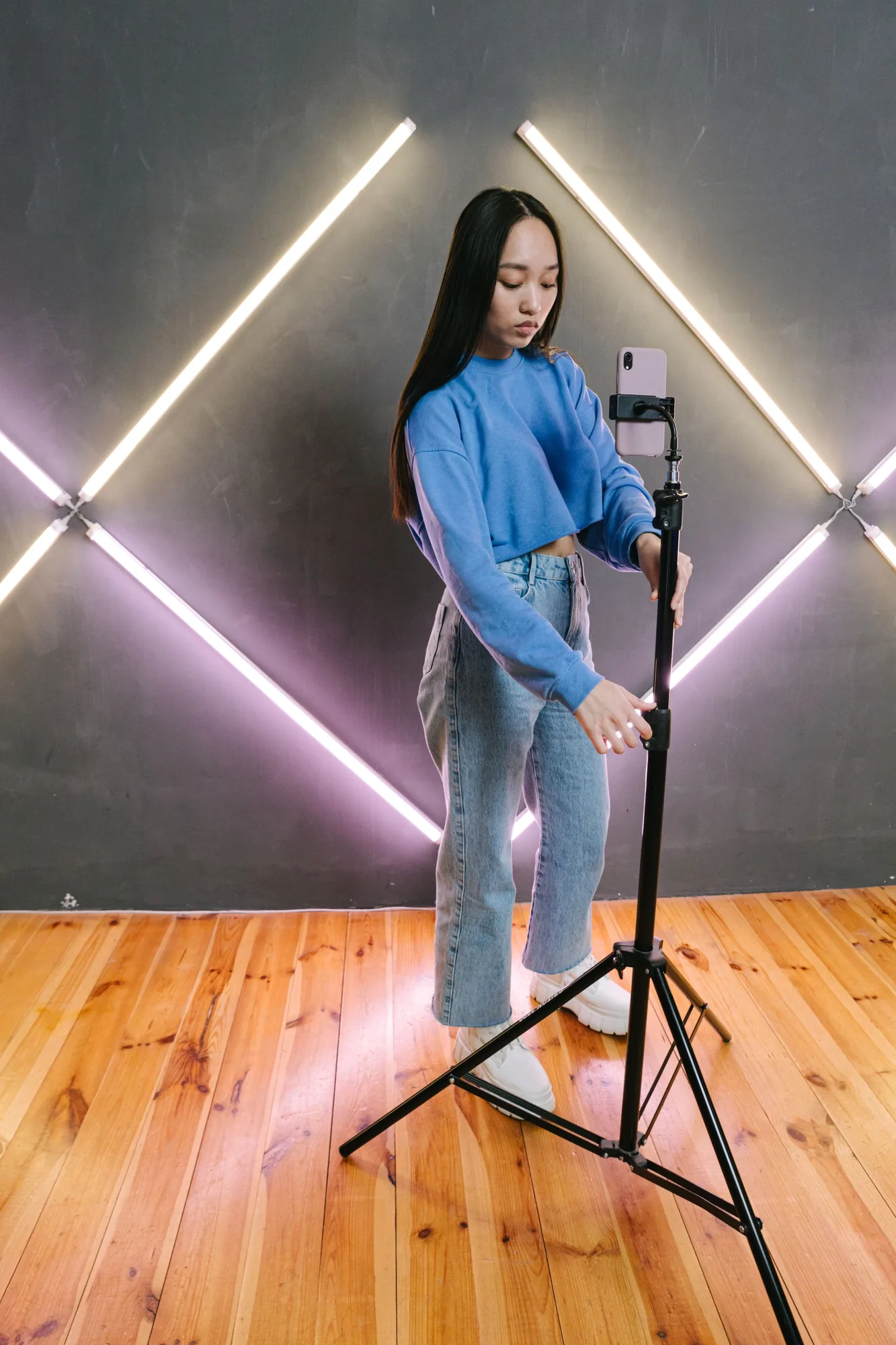 Creator recording a tutorial with a phone on a tripod